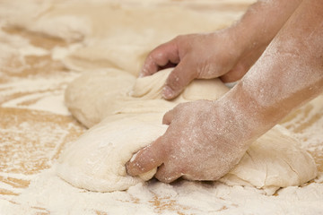 Fototapeta na wymiar Hands in the dough