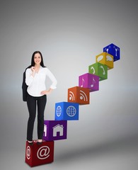 Composite image of pretty businesswoman smiling at camera