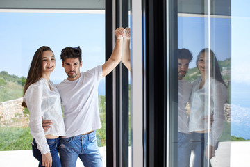 relaxed young couple at home staircase