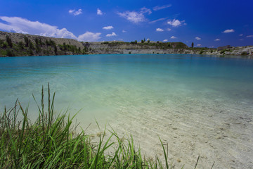 Flooded stone quarry. Crimea. Skalistoe village, Bakhchisaray region. Lake in quarry.