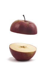 photo of an Organic apple cut in half. Isolated on white background. Studio shot