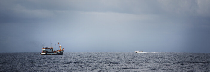 Motor boat on the horizon