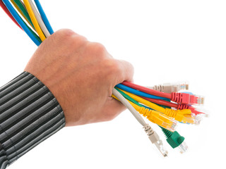 Hand holding a bundle of colorful network cables