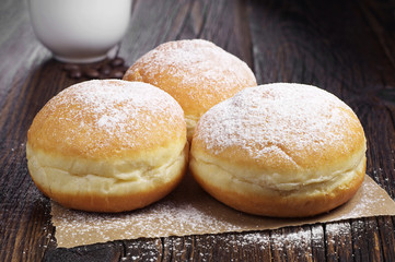 Donuts and coffee cup on table