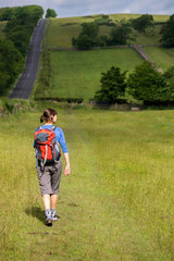 Hiker crossing a Stile