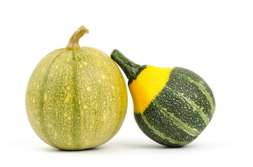 Raw pumpkins on white background