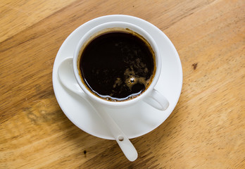 Cup of coffee on a wooden table