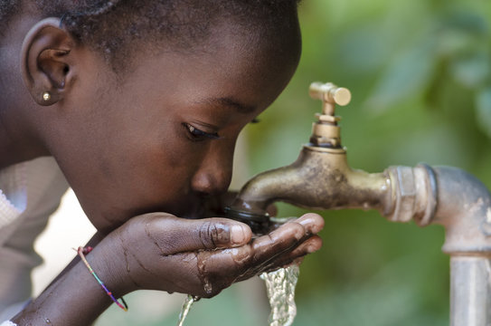 Close-Up of African Child Drinking Water (Drought Water Symbol)