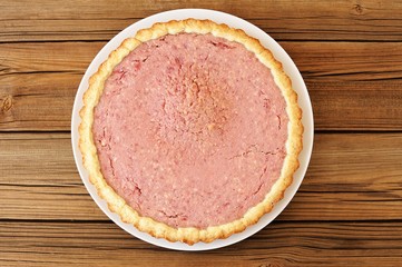 Strawberry round tart on wooden background