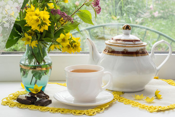 Tea drinking in the morning near the window