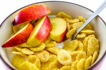 Breakfast with cornflakes on the white background