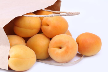 Apricot in a paper shopping bags