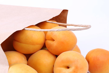 Apricot in a paper shopping bags