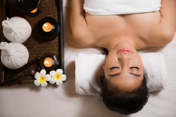 Obraz na płótnie Canvas woman having massage and spa salon Beauty treatment concept, She is very happy,top view
