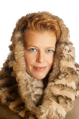 Blond caucasian woman with ecologic fur hood