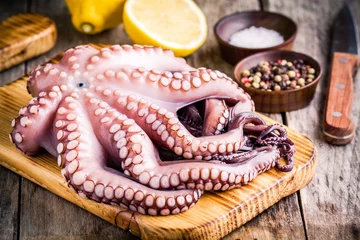 Fototapete fresh octopus in the bowl with lemon, sea salt and pepper © nblxer