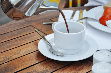Cocoa poured into white cup