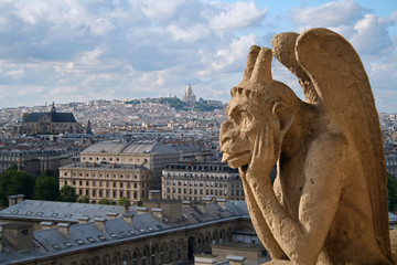Fototapeta na wymiar Gargoyle on Notre Dame Catheral in Paris