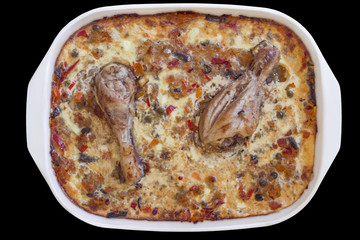 Pan of baked Chicken Meat and Vegetable Stew with Bechamel Sauce, Isolated on Black Background.
