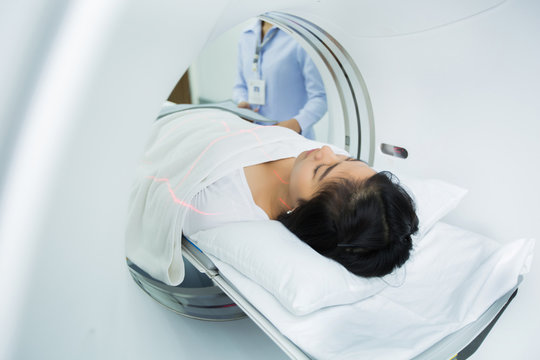 women entering the brain with a Ct scan
