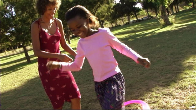 Family in park with hula hoop