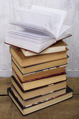 vintage books on  wooden background, education concept