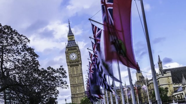 Timelapse view of the Big Ben and the House of Parliament , London. Seen through flags of Commonwhealt nations flying in the wind. With a flavour of the tower of Pisa