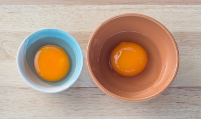 Two nutrient eggs in different ceramic bowl