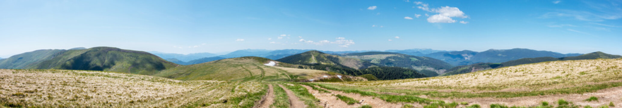 Panoramic view of amazing spring mountains with roads