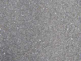Fototapeta na wymiar Texture of rough asphalt