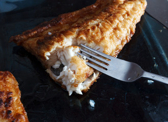 A piece of fish fillett fried in batter