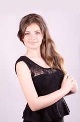 Beautiful girl holds hands hair