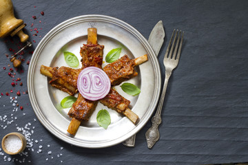 Pork ribs on old plate food abstract concept