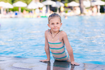 Cute little girl in swimming pool