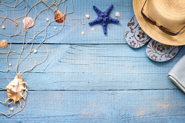 Seashells on blue boards vacation holiday background abstract concept