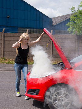 young woman with car on fire