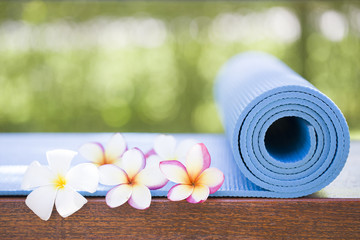 blue yoga mat and a flowers