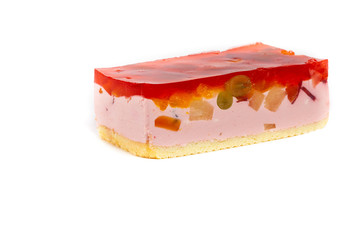 Fruit yogurt cheesecake with jelly on white background. Selective focus.