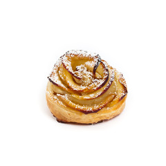 Pastry with apple shaped roses on white background. Macro. Selective focus.