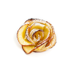 Pastry with apple shaped roses on white background. Macro. Selective focus.