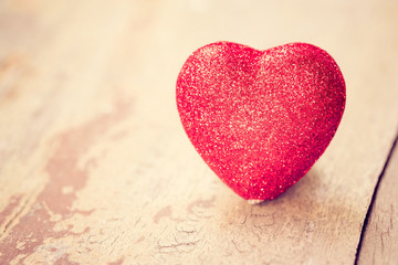 Fototapeta premium Valentine day concept. Heart on grunge wood background.