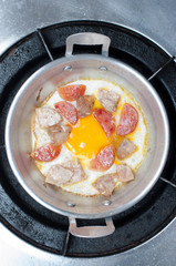 fried egg with pork in the pan of thailand