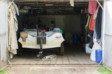 the garage with a motor boat inside