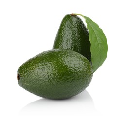 Avocado with leaf stands upright vertically isolated on white