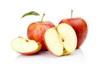 Close-up shot sliced red apple with leaf isolated
