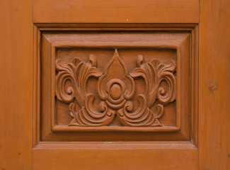 flower carved on wood background