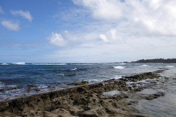 Fototapeta na wymiar Coral Rock along shore of Kaihalulu Beach