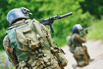 Military soldier with pistol