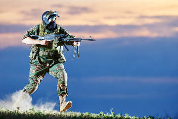 Military soldier with machine gun
