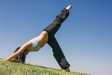 Woman doing yoga outdoors